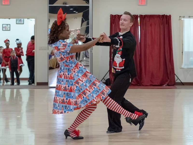 Denis dancing with student American Foxtrot at Holiday Showcase